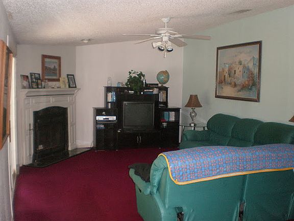 living room with working fireplace