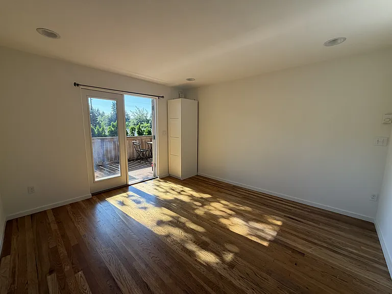 Another view of same room. Closet for coat/bags at the entrance
