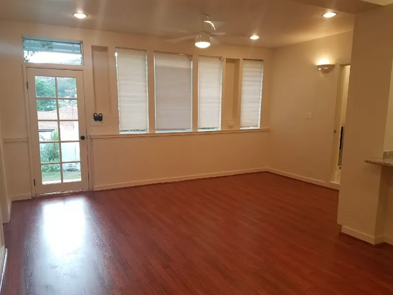 Large living room with two fans