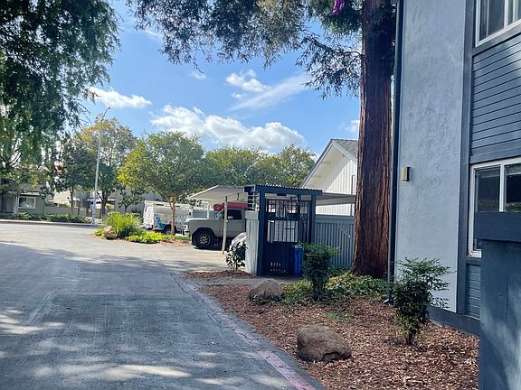 Parking lot facing the street. Plenty of street parking. Mailboxes are gated as seen in this photo.