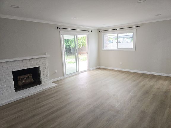 Living room with fire place and ample living space.