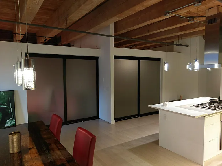 rolling frosted glass door entrances to bedrooms