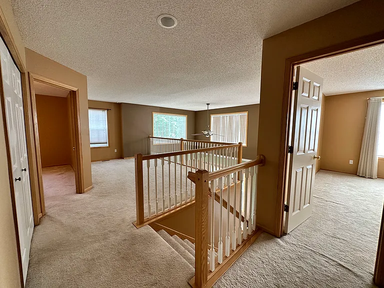 Second floor loft with master bedroom to the right and guest bedroom to the left.