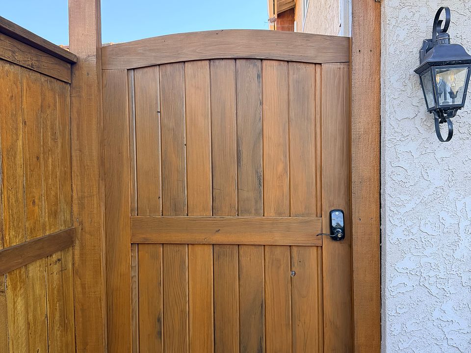 Private gate entry leads to unit door