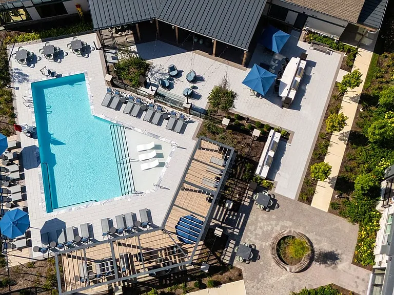 Pool, sundeck, and courtyard