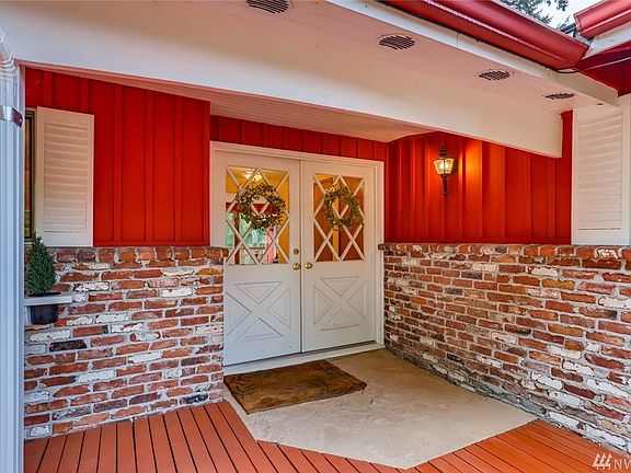 French doors lead into the entryway. The exterior brick was salvaged from a 100+ building demo in Seattle.