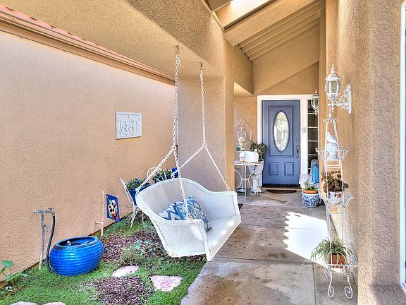 Secluded front courtyard features water fountains beautiful plants and  creates a buffer between you and the rest of the world.