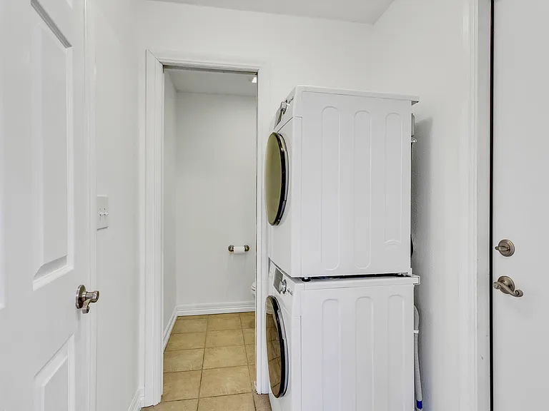 mudroom off garage with washer and dryer