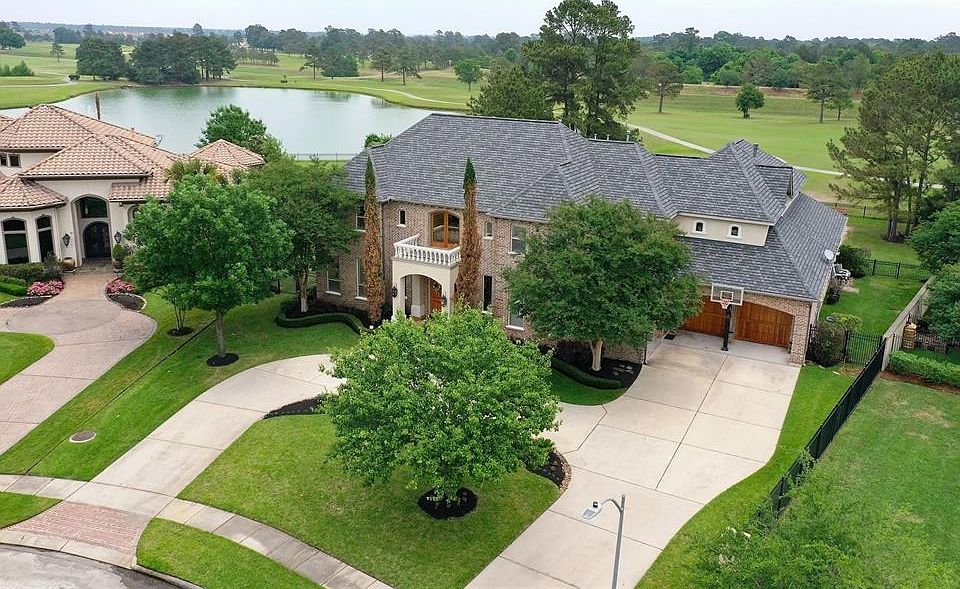 Stunning Tommy Bailey custom home in the gated enclave of Gleannloch Farms.