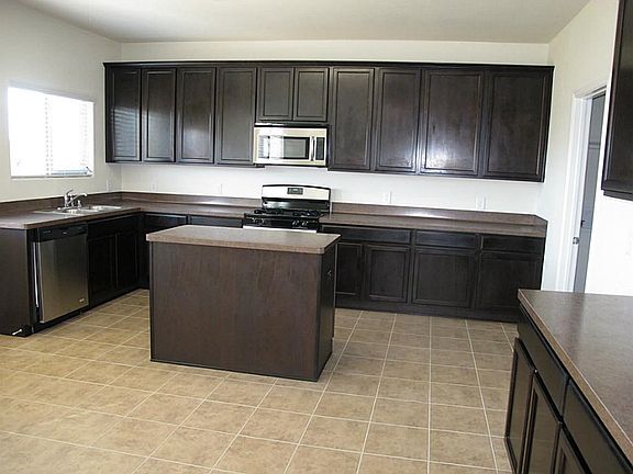 Stainless steel appliances and tile floors!