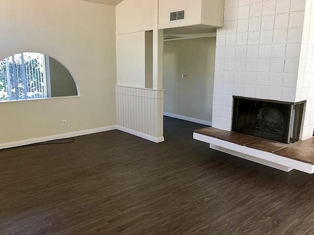 Living Room Overlooking Den with Wrap Around Fireplace