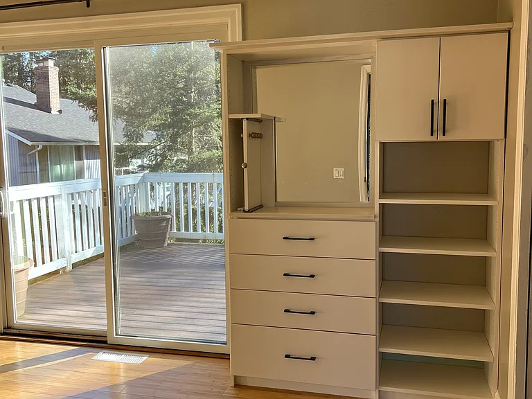 A build-in dresser in the master bedroom