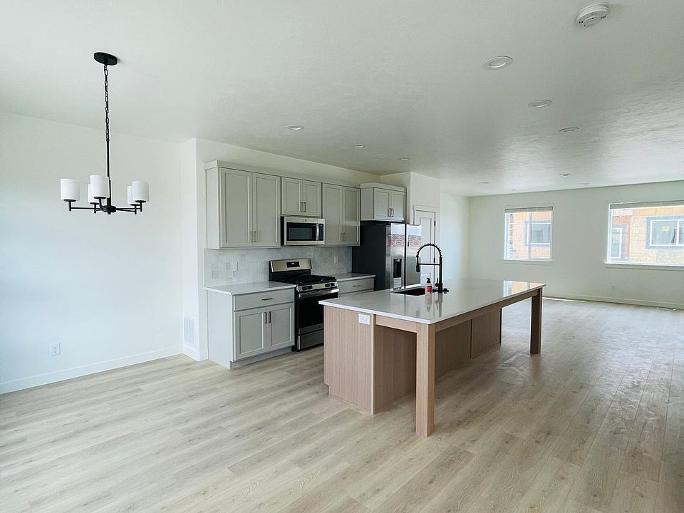 Large kitchen, dining and living areas.