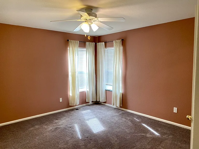 Master bedroom has been re-painted grey.