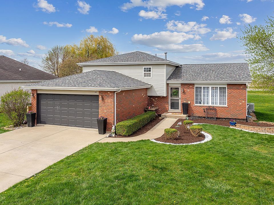 Simple landscaping with elegant curves and clean lines make the approach to this quad level home inv