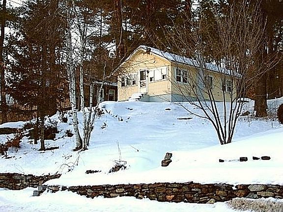 Front of house facing pond