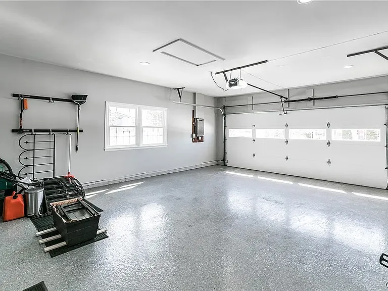 Garage with nice flooring and shelves