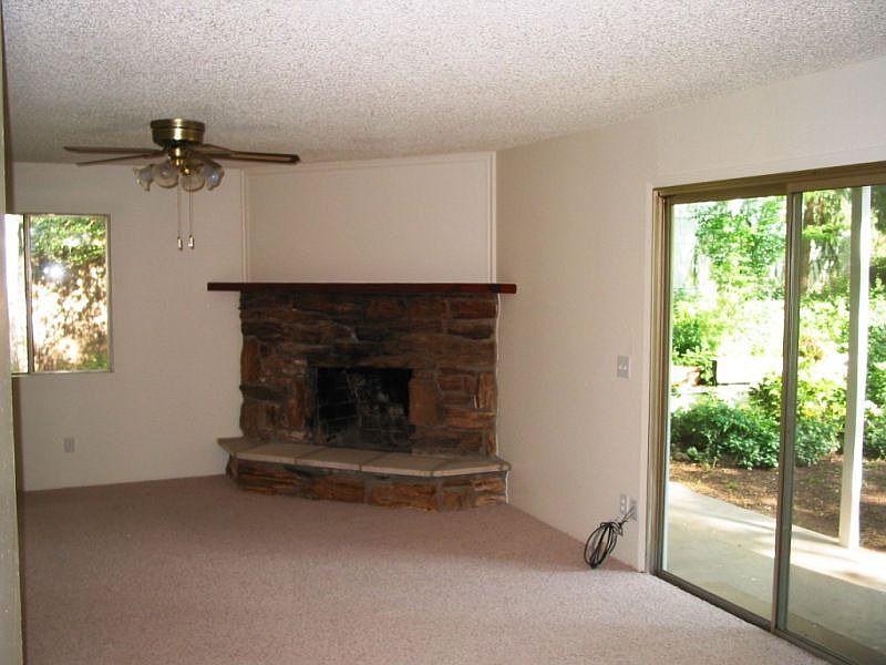 Living room with stone fireplace