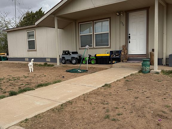 Sidewalk entrance to front door.