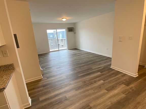 Living Space. (to the right is the kitchen) (to the right is the front entrance)