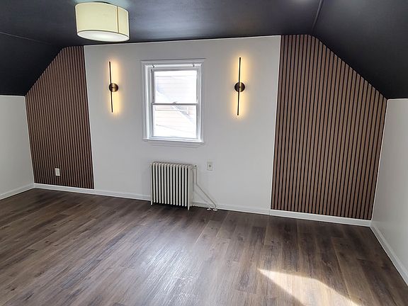 Dining Room with slat accent wall and sconces