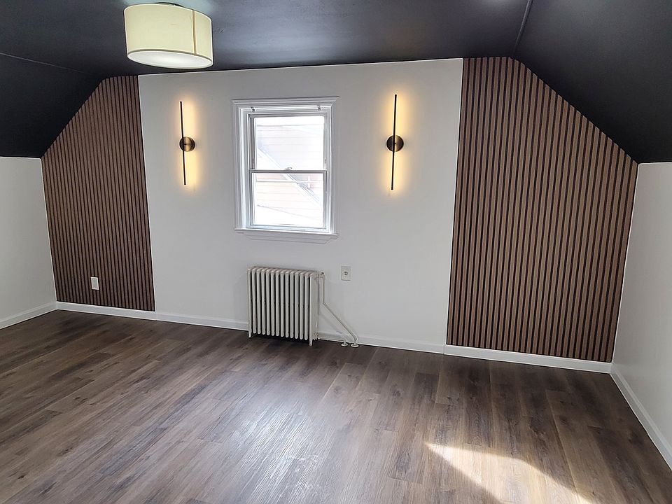 Dining Room with slat accent wall and sconces