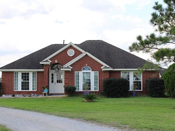 This custom Tilson home sits on 10.9 acres that is fenced and cross fenced.