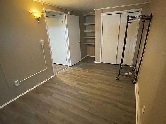 Large bedroom with closet and built-in shelves