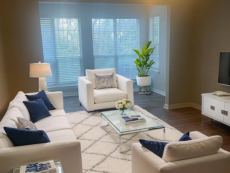 Introducing a serene living space at Riverwood Park Apartments, featuring elegant furnishings and abundant natural light. This inviting lounge is perfect for relaxation or entertaining. Don't miss outschedule a tour today!
