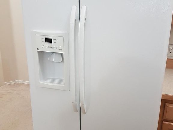 Extra large side by side refrigerator plumbed for ice and wa