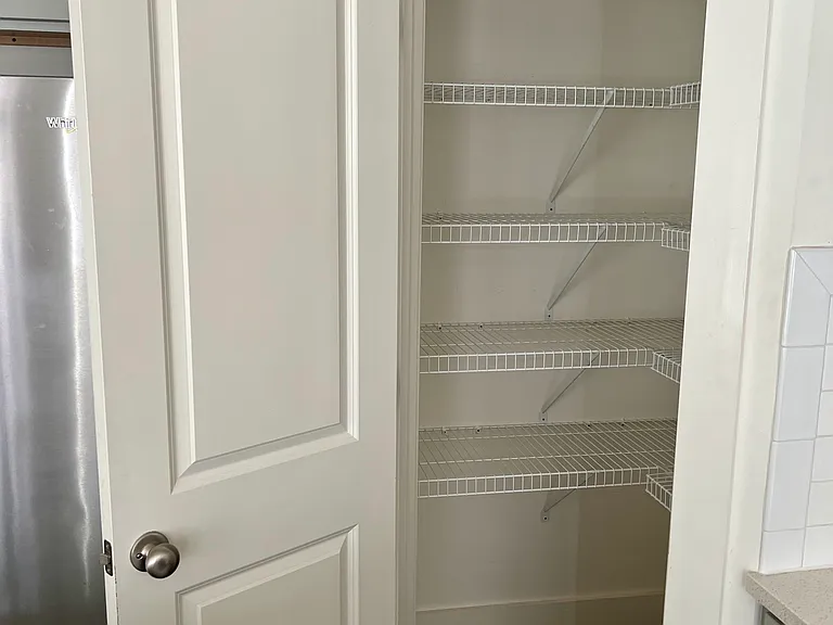 Pantry closet provides additional storage for kitchen necessities