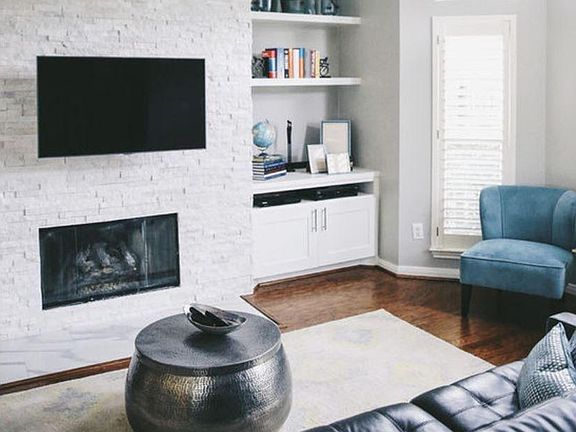 Stone gas fireplace with corner storage
