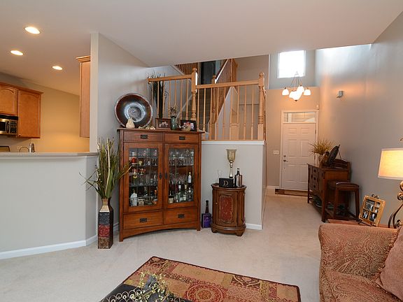 Two Story Foyer and Oak Railings, Brushed Nickel Lighting