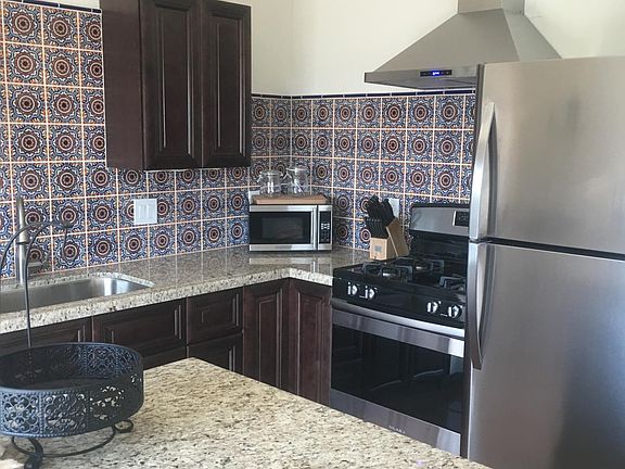 Beautiful kitchen with stainless appliances and granite counters