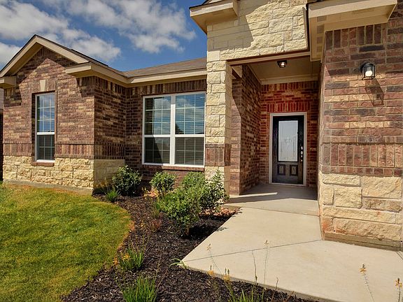 Beautiful exterior features brick and stone elevation and a fully landscaped front yard.