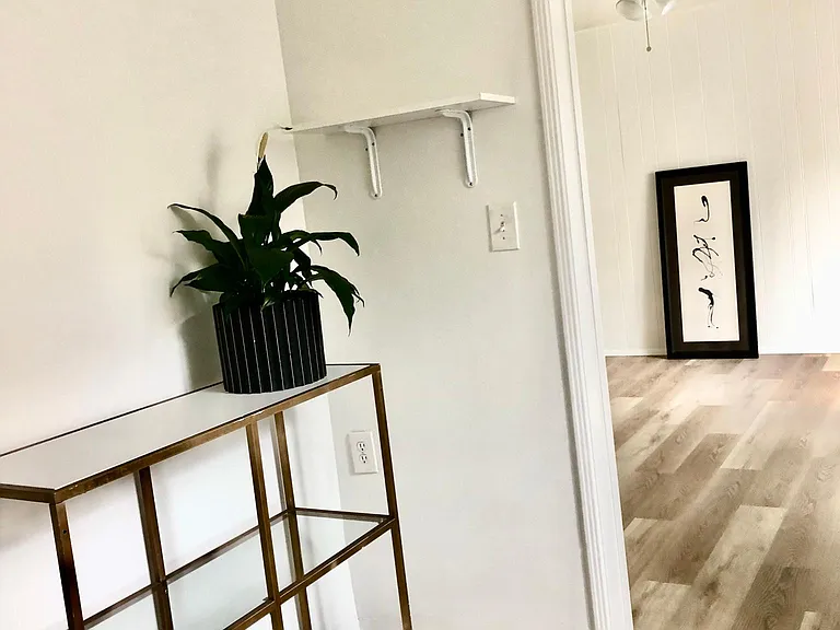 Go to the right and enter the kitchen. Looking into living room .