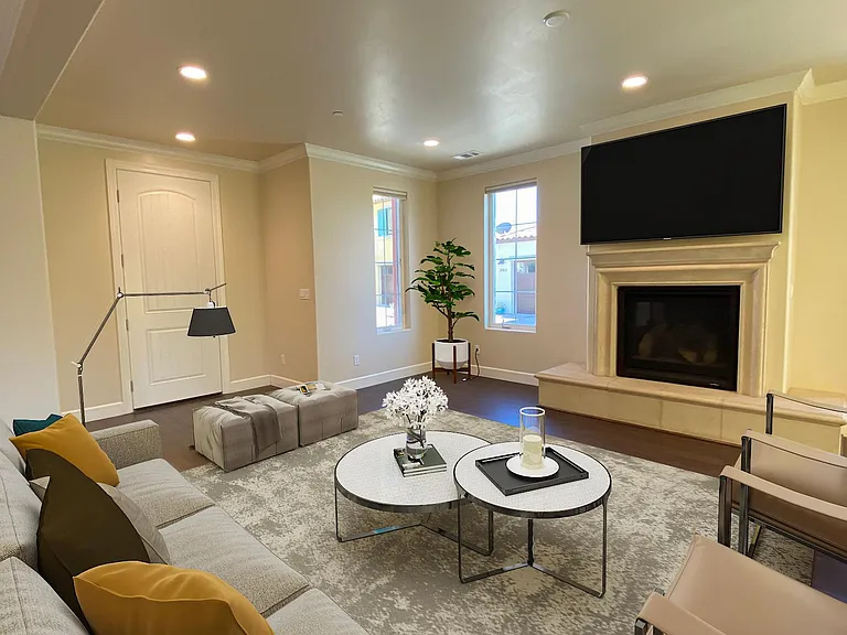 Comfortable gathering space with a cozy fireplace and open-concept design.