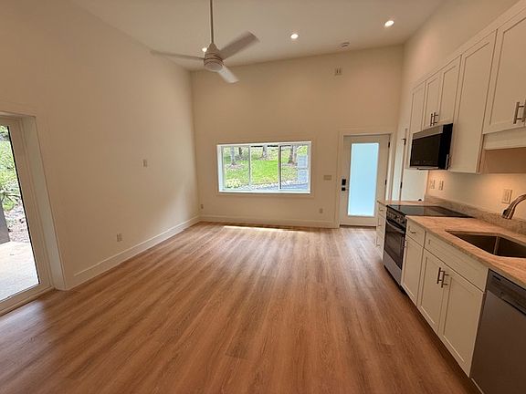 Living Area with Abundant Natural Light and High Ceilings
