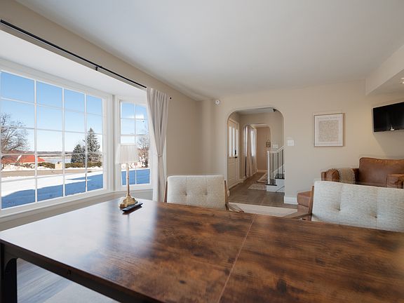 Spacious office with lake views, modern furniture and a TV