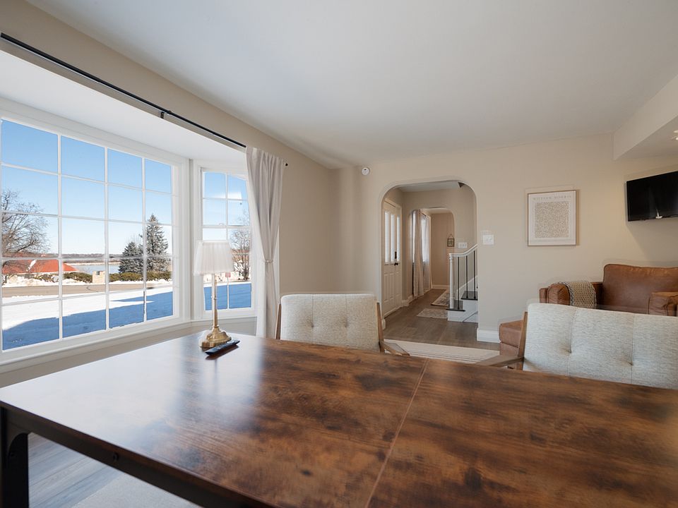 Spacious office with lake views, modern furniture and a TV