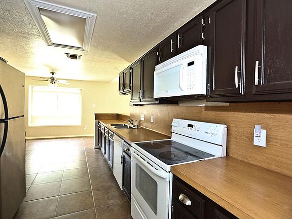 Kitchen with ample cabinet and counter space.