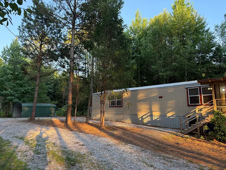 view of front yard, parking and carport