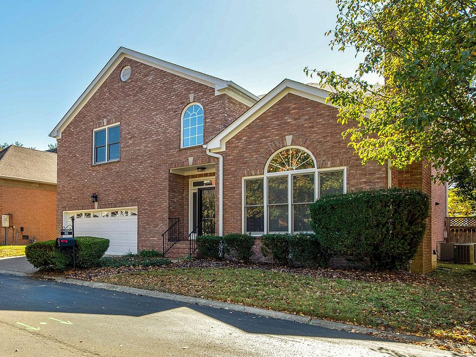 Front view showing nice landscaping and 2 car front entry garage.