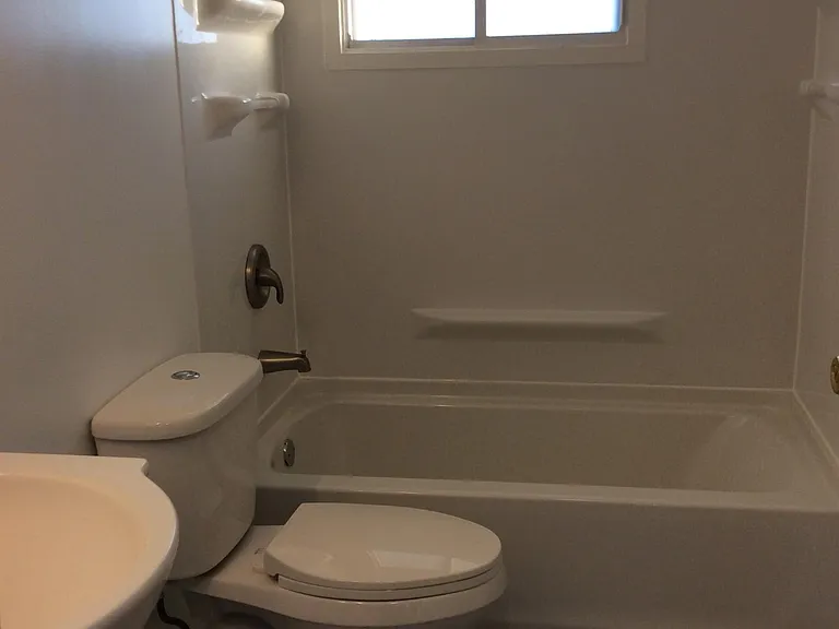 Completely remodeled bathroom with new tub, toilet, vanity,