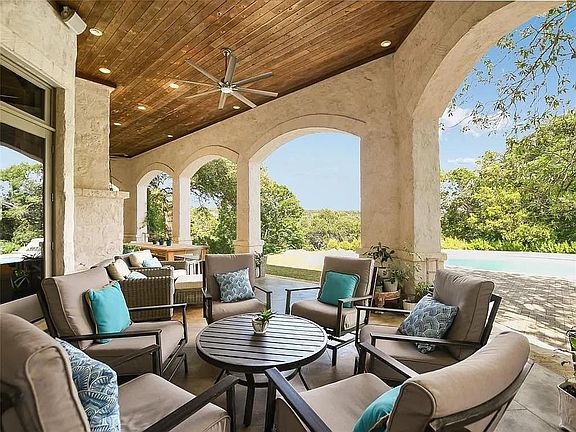 Expansive East facing covered terrace with ample outdoor sitting and dining space