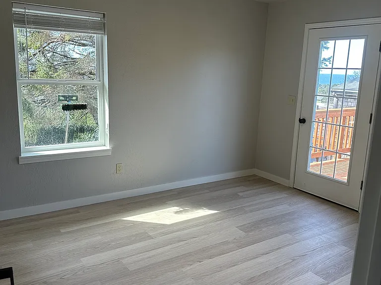 Primary Bedroom with door leading to the deck