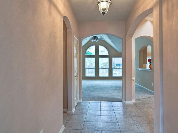 Tile entry leads to secondary bedrooms and formal dining room.