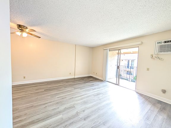 Living & dining area, looking onto patio.
