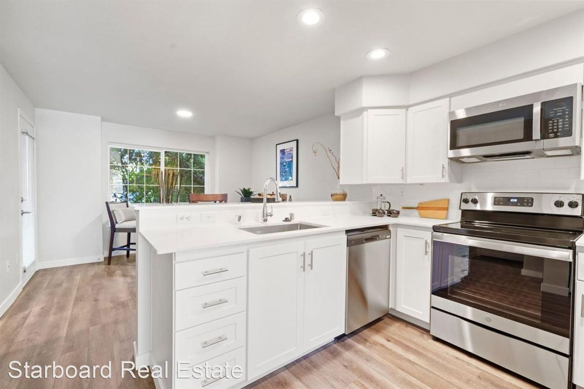 Open concept kitchen with granite countertops