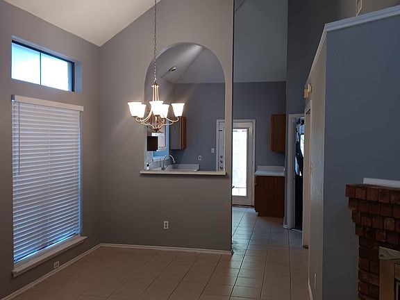 Open Living room and dining area with plenty of windows for natural light.